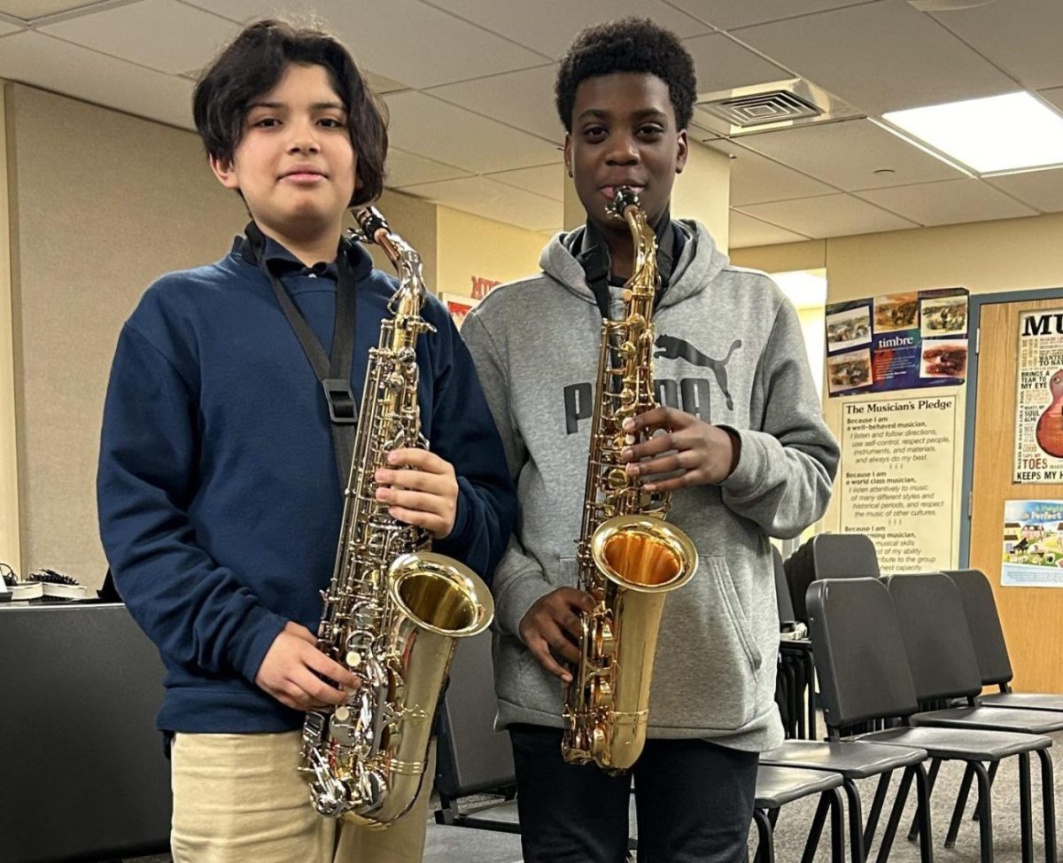 Sebastian and Ethan in the after school Band program playing the saxophone  